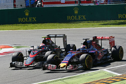Max Verstappen, Scuderia Toro Rosso STR10 and Jenson Button, McLaren MP4-30 battle for position