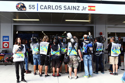 The media gather around the pit garage of Carlos Sainz Jr., Scuderia Toro Rosso in the third practice session