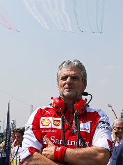 Maurizio Arrivabene, Ferrari Team Principal on the grid as a planes fly over