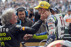 Race winner Valentino Rossi celebrates his 90th career victory with Angel Nieto