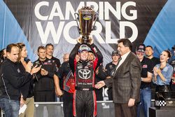 Championship victory lane: NASCAR Camping World Truck Series 2015 champion Erik Jones, Kyle Busch Motorsports celebrates with NASCAR President Mike Helton