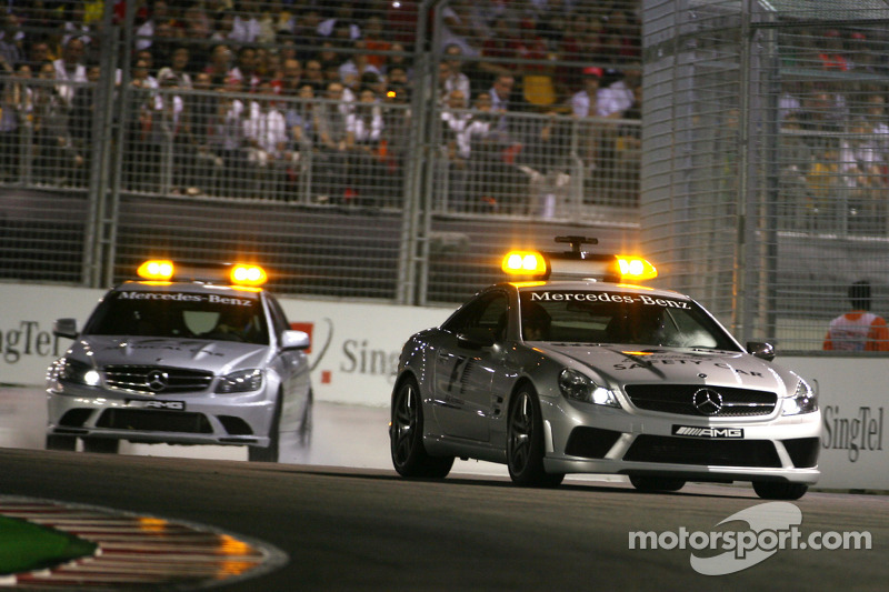 Safety car and medical car goes on track after Nelson A. Piquet, Renault F1 Team accident