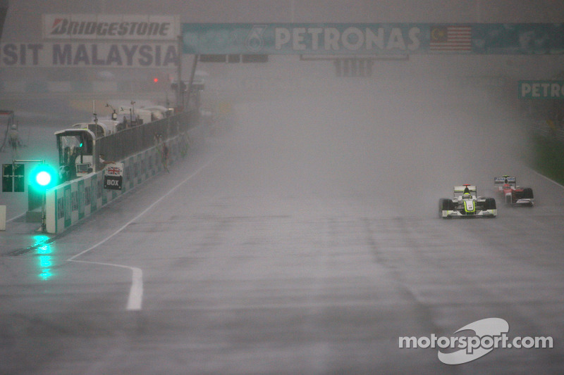 Jenson Button, Brawn GP and Timo Glock, Toyota F1 Team