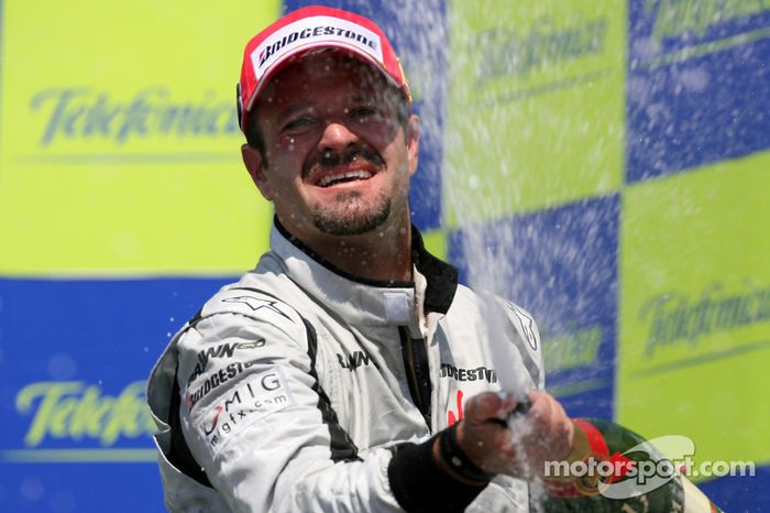 Podium: champagne celebration for race winner Rubens Barrichello