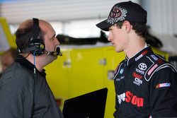 Joey Logano talks with crew chief Kevin Kidd